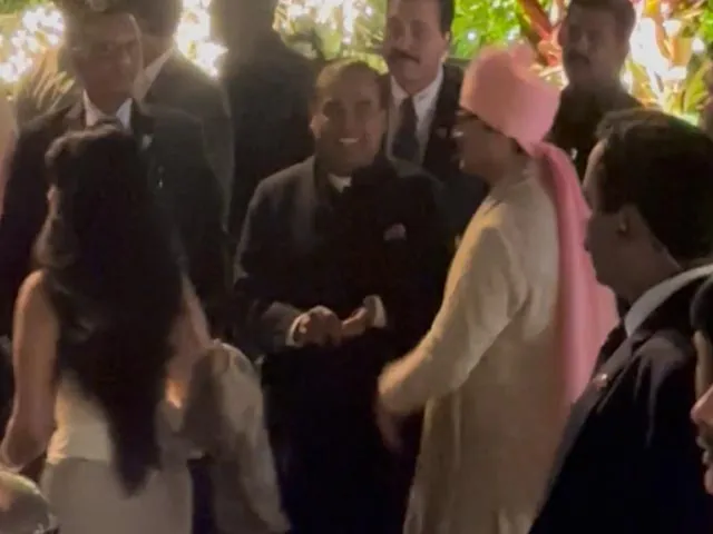 Mukesh Ambani and Nita Ambani attend the wedding